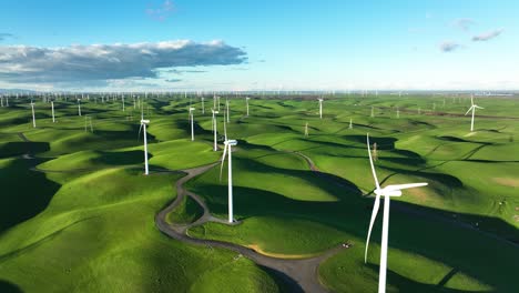 Aerial-view-of-Wind-Turbine-Farm-in-slow-motion-on-green-rolling-hills,-Montezuma-Hills-California