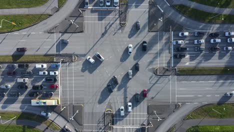 Top-down-view-of-crossroads-intersection-during-rush-hour-traffic