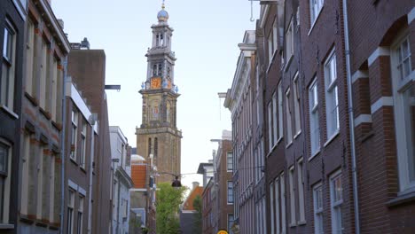 Wide-tracking-shot-revealing-the-bell-tower-of-the-17th-century-church-the-Westerkerk-in-Amsterdam,-where-Rembrandt-is-buried