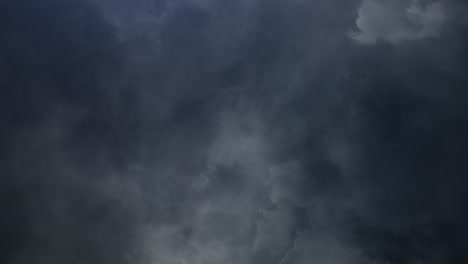 lightning-flashes-inside-dark-clouds-in-the-sky,-thunderstorm-4K