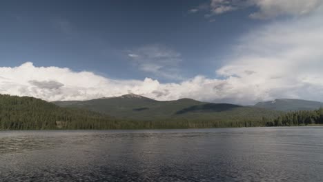 A-scenic-view-of-a-north-Idaho-lake-near-the-border-of-Canada-with-clouds-forming-over-the-mountains