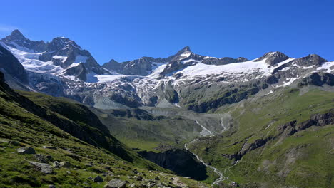 Scenic-View-Of-The-Trift-Valley-Surrounded-By-Alpine-Summits-And-Glacier-In-Zermatt,-Switzerland---static-shot