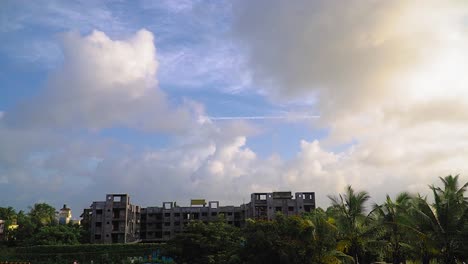 Morning-Time-lapse-clouds-moving-opposite-direction-against-blue-sky,-Abandoned-Construction-Site