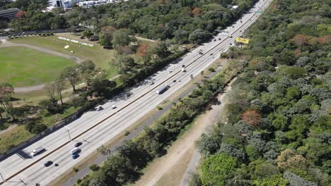 Aerial-view-of-a-modern-highway-with-many-cars-passing-at-high-speed