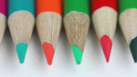 Set-Of-Color-Pencils-On-White-Background---macro,-panning-shot