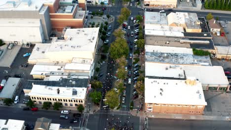 Provo,-Utah---USA---July-1st-2020:-Aerial-flyover-drone-shot-of-Pro-Trump-protestors-walking-in-the-middle-of-center-street-after-a-shooting-at-a-Black-Lives-Matter-Protest-the-day-before
