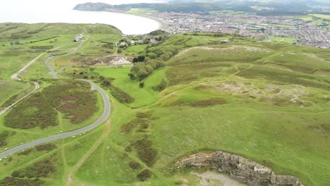 Great-orme-summit-aerial-descending-view-hill-of-names-hillside-stone-words-attraction-mountain-artwork-Llandudno
