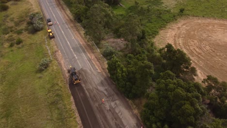 Aerial-view-of-countryside-road-widening-using-heavy-machines