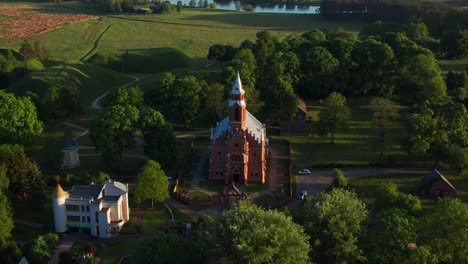 Aerial-View-Of-Church-Of-The-Holy-Virgin-Mary-In-Kernave,-Lithuania---drone-pullback