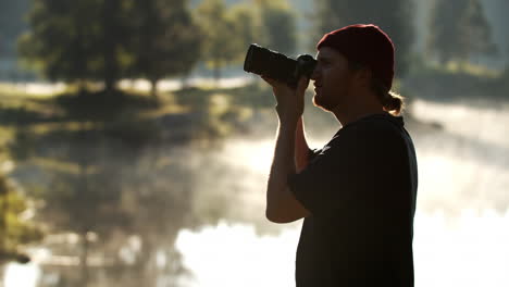 Caucasian-Man-Taking-Pictures-Of-Scenery-With-DSLR-Camera---medium-shot