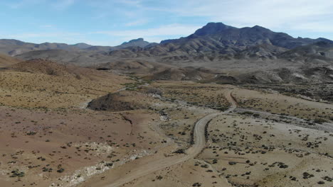 Aerial-forward-view-of-isolated-road-in-middle-of-desert