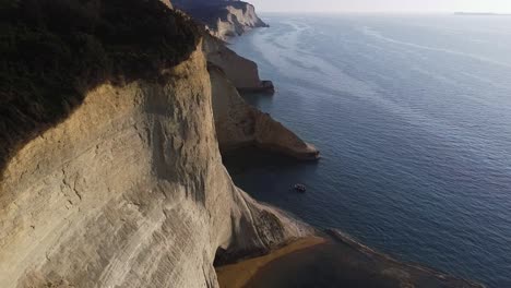 Lonely-boat-standing-in-front-of-huge-cliffs