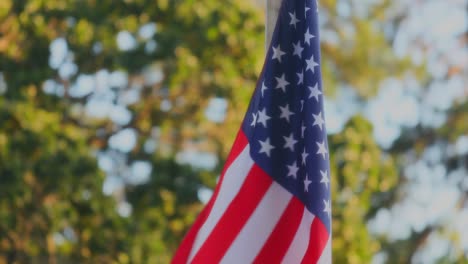 Close-Up-Of-Waving-American-Flag-Fabric-With-Stars-And-Stripes-On-Flagpole