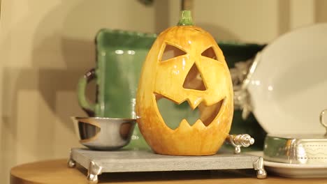 pumpkin-head-in-glass-as-home-table-decoration,-halloween-celebration