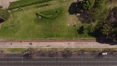 Aerial-top-down-sideways-over-pedestrian-and-cycle-path-in-Recoleta-Area,-Buenos-Aires