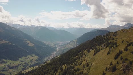 Drone-shot-slow-fly-over-a-mountain-looking-over-a-valley-in-Switzerland-in-4k