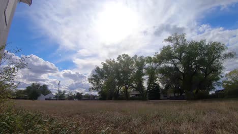 TIMELAPSE---Across-a-field-in-a-small-town-near-Alberta-Canada-on-a-cloudy-day-during-the-daytime