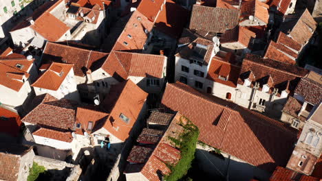 Red-Rooftops-At-Croatian-Town-Of-Trogir-In-Summer---aerial-drone-shot