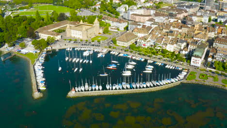 Morges-Town-With-Sailboats-And-Yachts-Anchored-On-The-Harbor-By-The-Lake-Leman-In-Vaud,-Switzerland