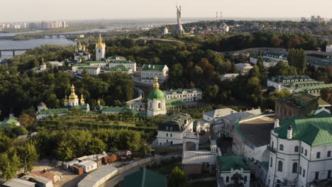 Aerial-view-on-Kyiv-city,-Dnipro-River,-Motherland-Monument,-and-Kyiv-Pechersk-Lavra-In-Kiev,-Ukraine---drone-shot