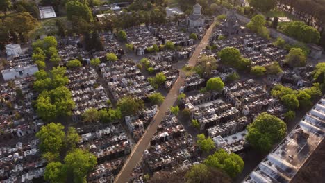 Aerial-flyover-beautiful-peaceful-Chacarita-Cementery-in-Buenos-Aires-durng-sunset