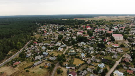 Beautiful-town-of-Merkine-in-majestic-Lithuanian-landscape,-aerial-pan-right-view