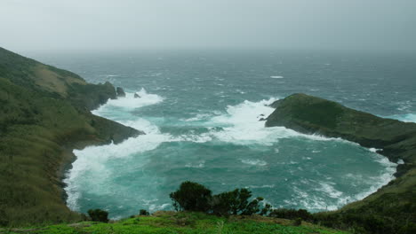 A-stormy-Azorean-coastline,-from-Monte-da-Guia,-Horta,-Azores