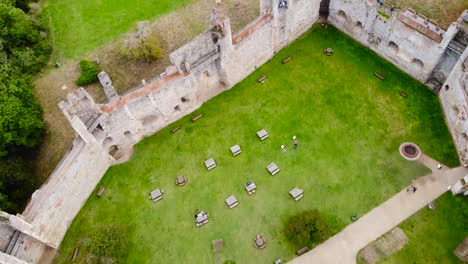 Flying-over-Framlingham-Castle-wall-at-Suffolk,-England---aerial-drone-top-down-shot