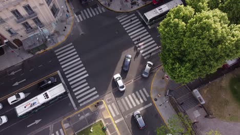 Rising-aerial-view-of-cars-crossing-the-junction-during-green-traffic-light