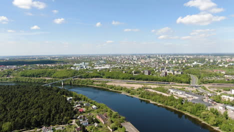 Majestic-view-of-Panemune-private-homes-and-Kaunas-city-in-horizon,-aerial-shot