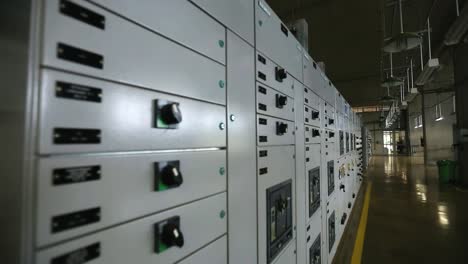 Rack-focus-shot-across-a-control-interface-inside-of-a-water-processing-plant