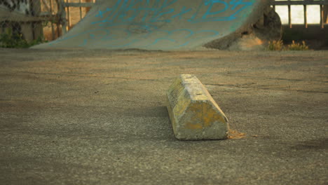 Skateboard-slide-of-side-of-concrete-parking-board,-close-up-view