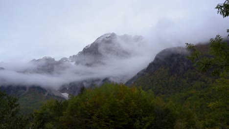 Fog-covering-high-mountains-in-Alps-after-the-first-snow,-timelapse-of-misty-scenery-in-Balkans