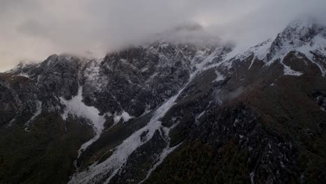 Mountains-of-Albanian-Alps-covered-in-snow-and-fog-in-a-dramatic-winter-scenery