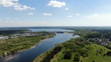 Kaunas-Hydroelectric-power-plant-in-horizon,-high-angle-drone-view
