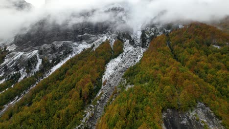 Idyllic-mountain-landscape-in-Autumn-with-colorful-forest-and-snowy-slopes-in-Alps-of-Albania