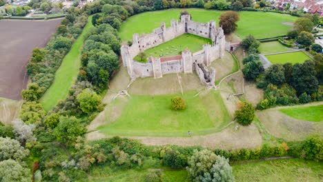 Aerial:-Framlingham-Castle-at-countryside-area-in-Suffolk,-England---drone-flying-forward-shot