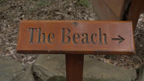 The-Beach-Letters-With-Arrow-Sign-Carved-Into-Wood-In-QLD,-Australia