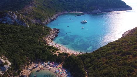 Aerial-shot-of-stunning-lagoon-with-wild-beach-and-sunbathing-people