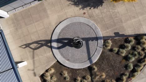 Top-View-Of-An-Artistic-Swirl-Sculpture-In-An-Outdoor-Garden