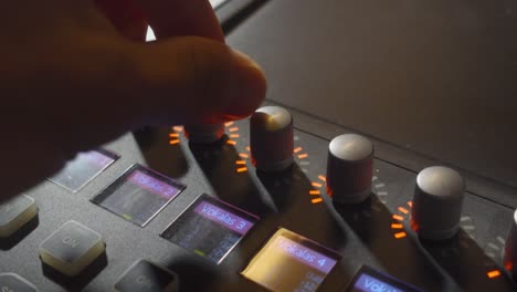 A-Person-Turning-a-Few-Knobs-on-a-Music-Mixer