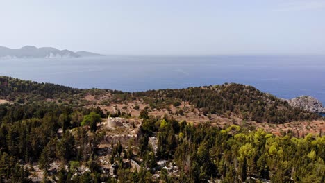 Famous-Ancient-Structure-Of-The-Assos-Fortress-On-Top-Of-Mountain-In-Cephalonia-Greece---aerial-shot