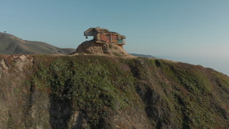 Tilt-Up-Reveal-of-WWII-Devil’s-Slide-Bunker-on-California-Coast-Highway-One-Aerial-Fly-Over