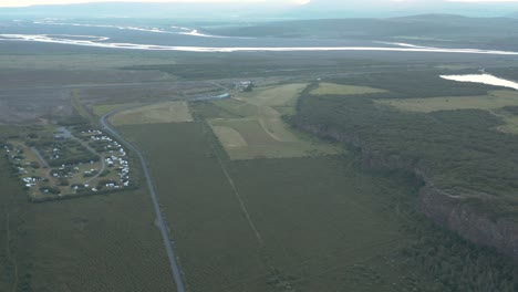 Aerial-view-of-Asbyrgi-valley-with-Ásbyrgi-campground,-travel-destination-in-Iceland