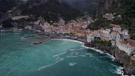 Breathtaking-Aerial-View-of-the-Gorgeous-Touristic-Town-of-Amalfi,-Italy---Aerial-Drone-Establishing-View
