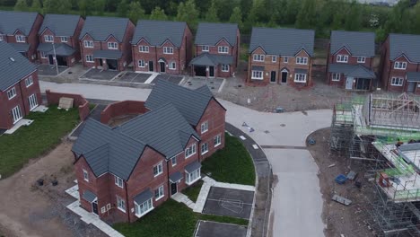New-property-incomplete-neighbourhood-housing-construction-site-aerial-view