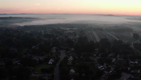Aerial-flight-over-USA-town-at-break-of-dawn