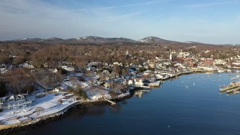 Aerial-footage-flying-forward-and-down-into-a-quiet-Camden-Harbor-on-a-cold-winter-morning