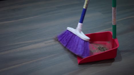 sweeping-the-house-with-broom-and-shovel-picking-up-the-garbage-from-the-house