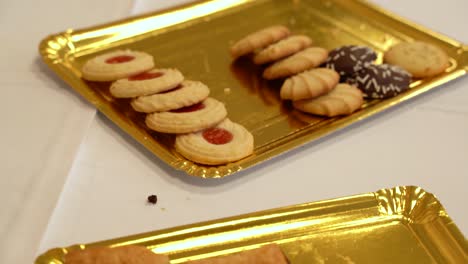 Trays-Of-Bread-Roll-And-Assorted-Cookies-On-The-Buffet-Table